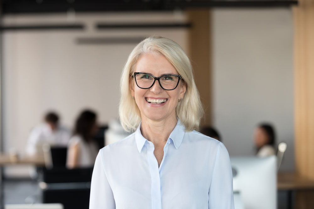 Cheerful Senior Businesswoman In Office